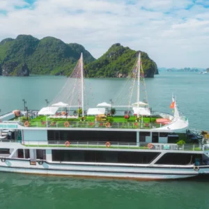 Apollo Halong Bay Day Cruise Tour boat sailing past limestone karsts under clear blue sky