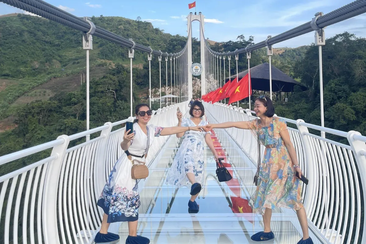 Cross the Bach Long Glass Bridge