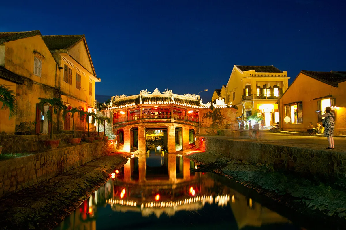 The historic Japanese Covered Bridge illuminated at night in Hoi An Ancient Town, Vietnam