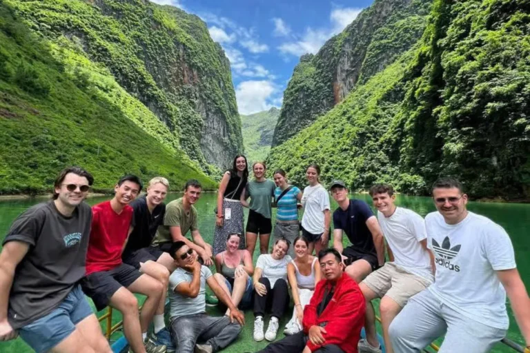 About Us 19 Group of tourists on a boat trip through Tu San Canyon on the Nho Que River in Ha Giang