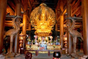 Golden thousand-armed Avalokiteshvara statue inside the Lady Buddha Hall at Bai Dinh Pagoda, Ninh Binh