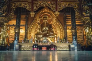 Massive golden seated Buddha statue inside Phap Chu Hall at Bai Dinh Pagoda, Ninh Binh Province