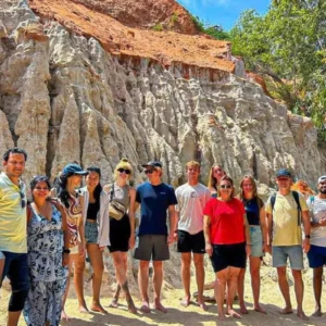 Tour group at Mui Ne's red and white sandstone canyon on a 21-day Vietnam tour